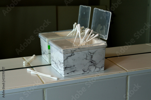 cotton cosmetic sticks
 woman mirror