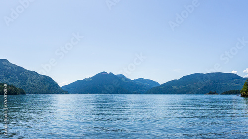 Blue clear sky over harrison lake british columbia canada background.