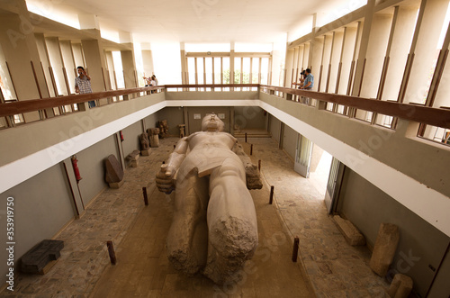 MEMPHIS, EGYPT, APRIL 20: Tourists witness the massive colossus of King Ramses II lying in the open air museum of Memphis, Egypt on April 20, 2018
