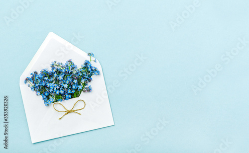 forget me nots in a mail envelope with cute twine bow