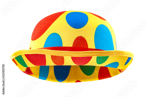 Obraz na płótnie Humorous headgear concept with floating clown bowler hat in red, blue, green and yellow colors isolated on white background with clipping path cutout using the ghost mannequin technique w salonie