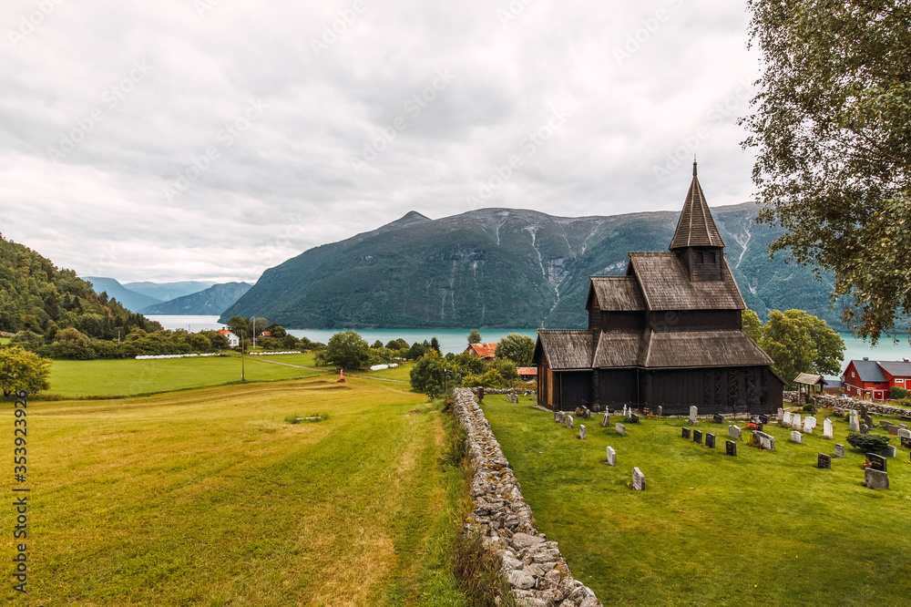 Reconstructed wooden church in Norway with cemetery. Reconstructed wooden church in Norway with cemetery.