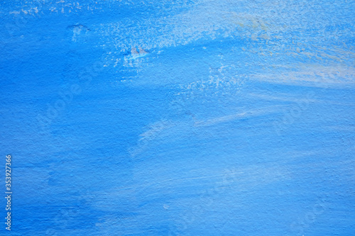 Blue Brush Stroke Painting on Concrete Wall Texture Background.
