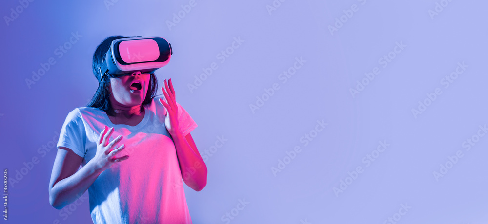 Getting to know digital world. Frightened girl in virtual glasses Getting to know digital world. Frightened girl in virtual glasses