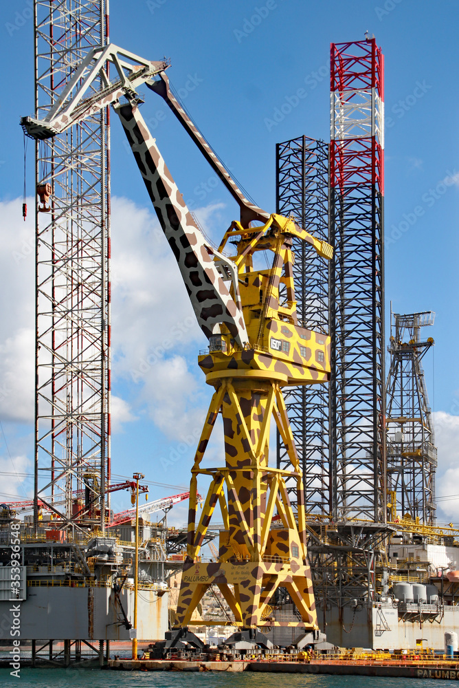 VALLETTA, MALTA - NOVEMBER 14TH 2019: A huge crane by the dockside painted to look like a giraffe VALLETTA, MALTA - NOVEMBER 14TH 2019: A huge crane by the dockside painted to look like a giraffe