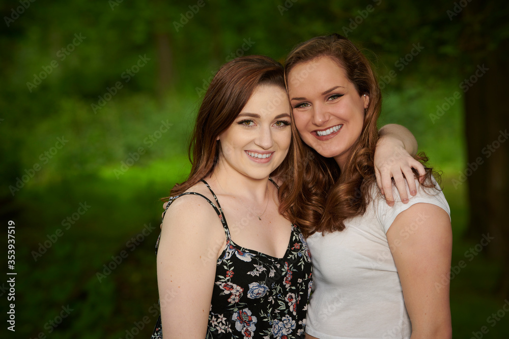 Two stunning young Caucasian women smile together Two stunning young Caucasian women smile together