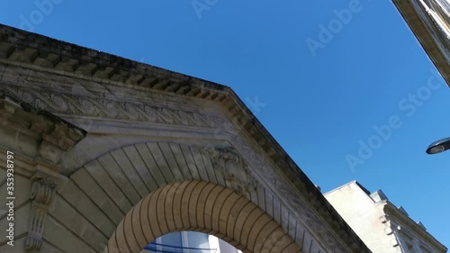Typical ancient facade with beautiful arch in center of city south of France