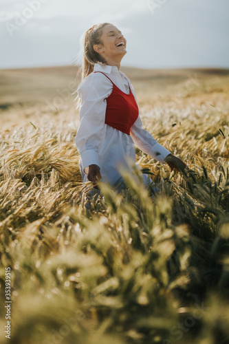 Beautiful girl walks in the field