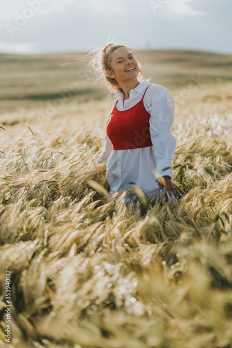 Beautiful girl walks in the field