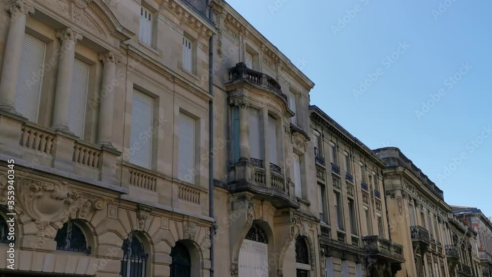 Beautiful facades of typical ancient houses in a residential area in center of city south of France Beautiful facades of typical ancient houses in a residential area in center of city south of France