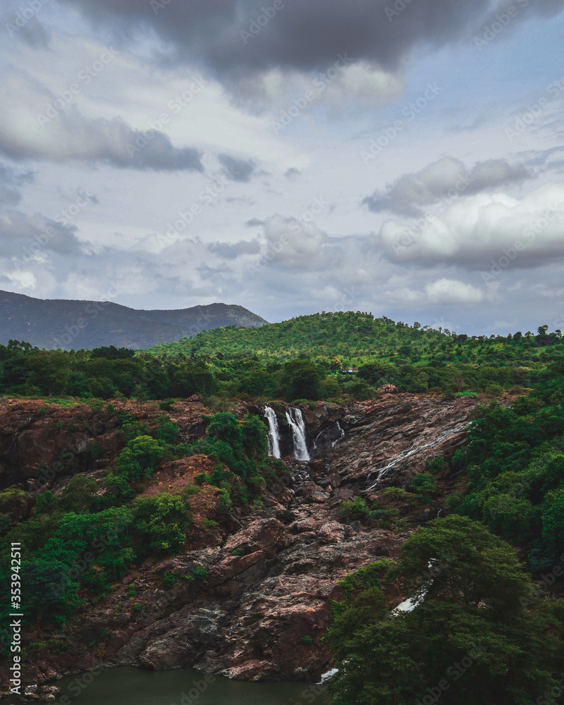 A photograph showing a landscape view of the serene and spectacular Barachukki Waterfalls, located in the state of Karnataka. This is one of the famous tourist landmarks in India