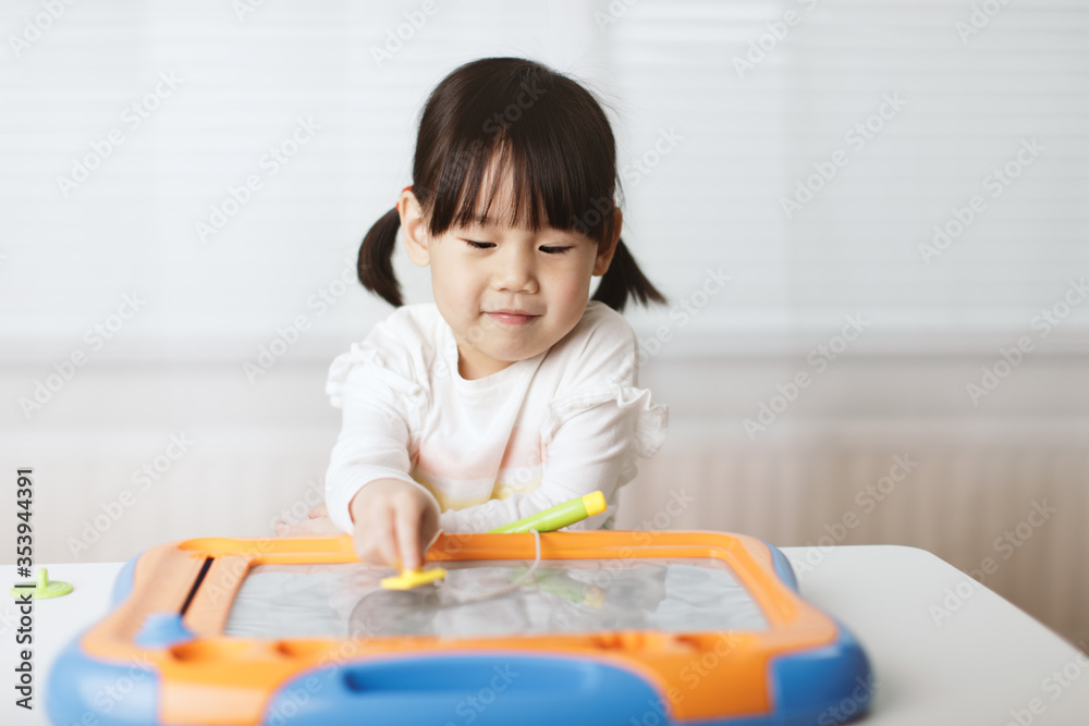 toddler girl learn drawing at home against white background toddler girl learn drawing at home against white background