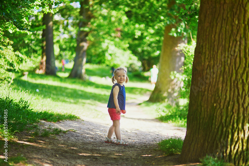 Adorable toddler girl walking in park or forest © Ekaterina Pokrovsky