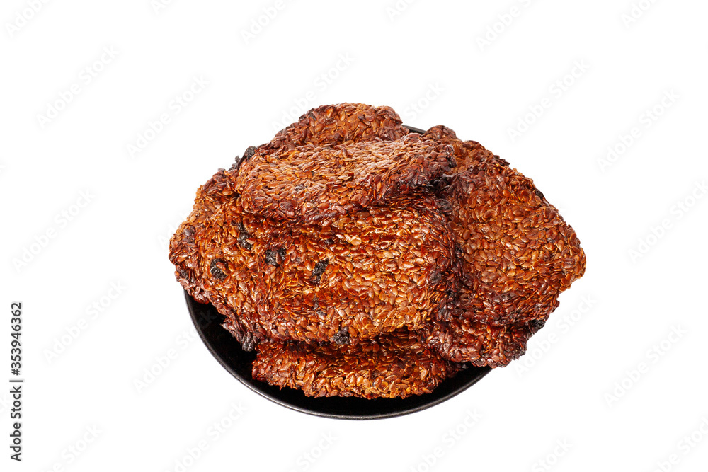 Oats butter cookie with sesame on a black plate Oats butter cookie with sesame on a black plate