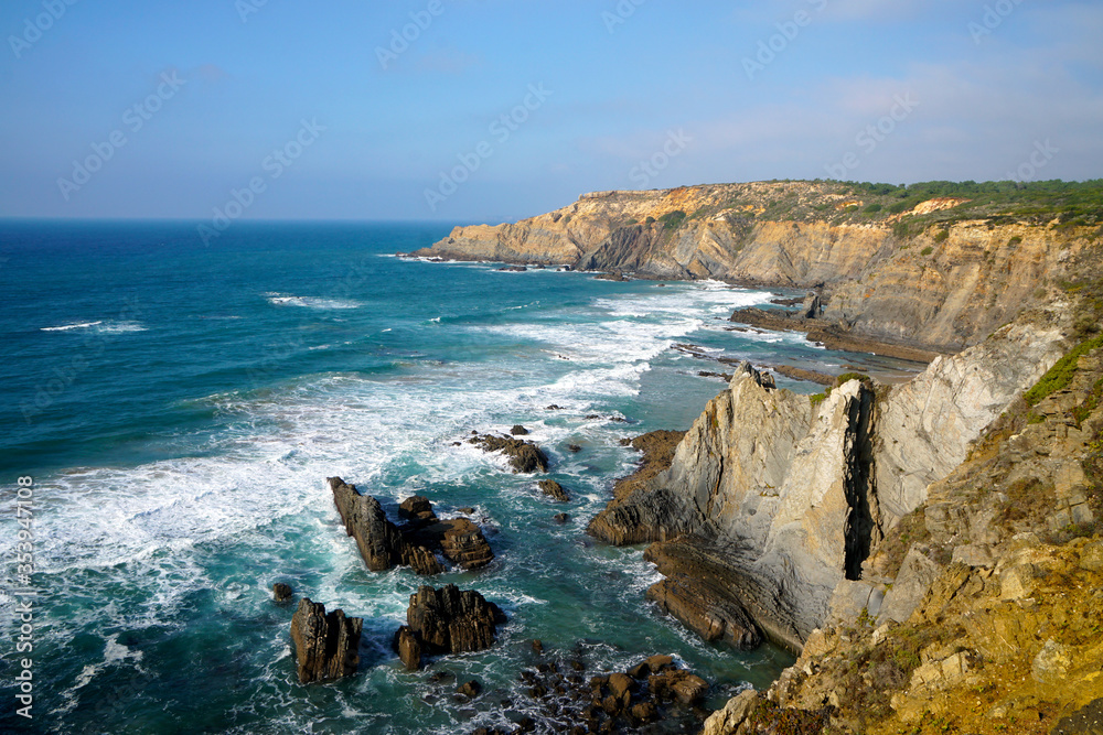 rocky cliff at typical beach at the west coast of Portugal