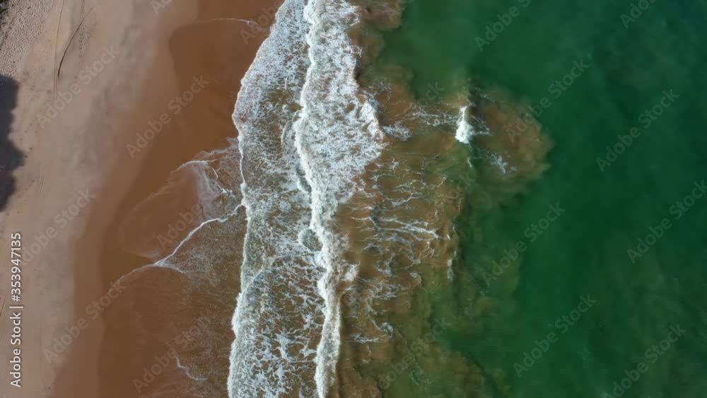 Gorgeous aerial top bird's eye side view of a exotic tropical beach in Tabatinga near Joao Pessoa, Brazil on a warm summer day. Gorgeous aerial top bird's eye side view of a exotic tropical beach in Tabatinga near Joao Pessoa, Brazil on a warm summer day.