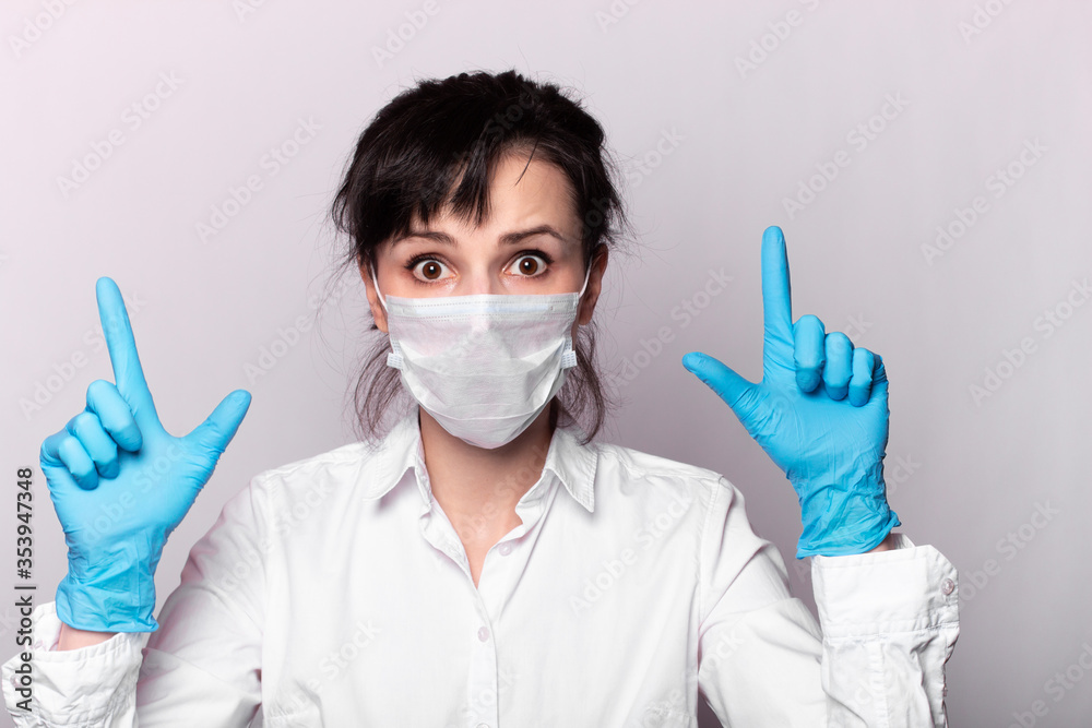 girl in a white shirt, a medical mask and gloves girl in a white shirt, a medical mask and gloves