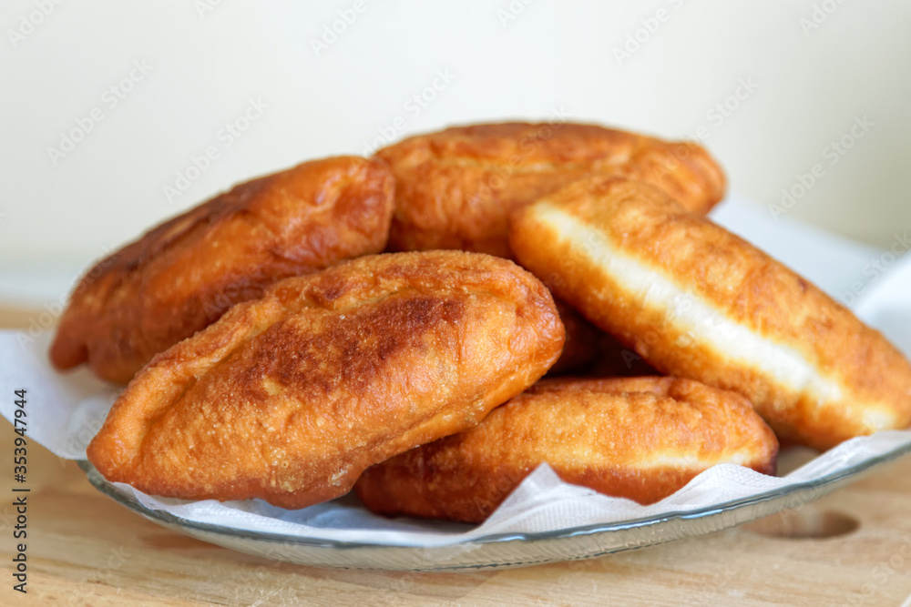 Close-up of deep-fried patties. Homemade bakery. on a wooden table Close-up of deep-fried patties. Homemade bakery. on a wooden table