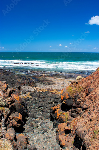 Black rocks on Smith`s beach on Phillip island in Australia