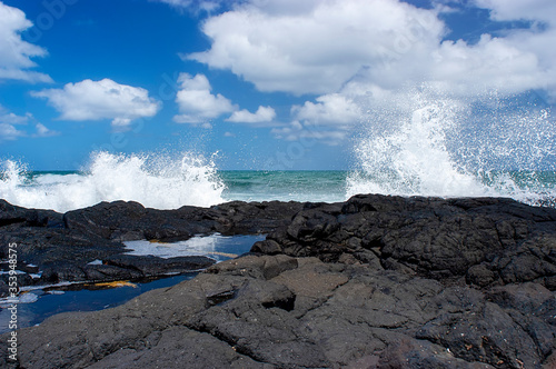 Black rocks on Smith`s beach on Phillip island in Australia