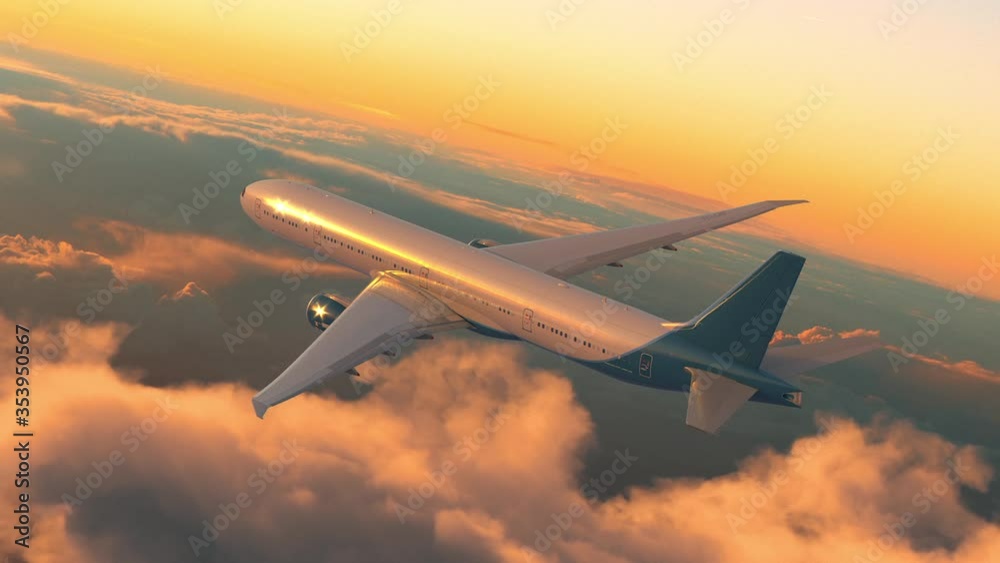 Commercial jet airplane flying above the clouds on sunset