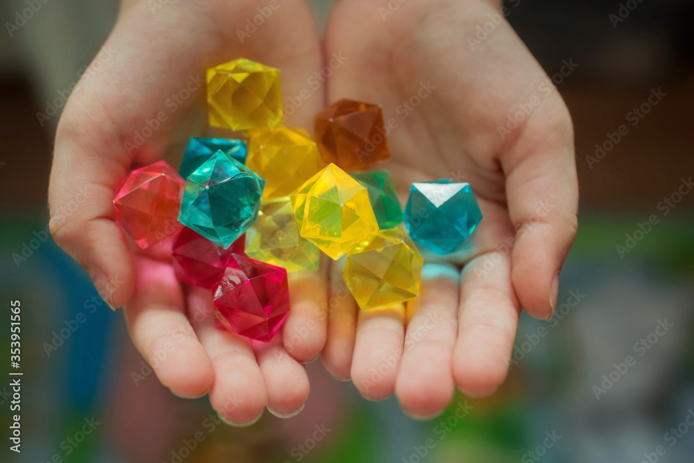 Decorative crystals in children's hands