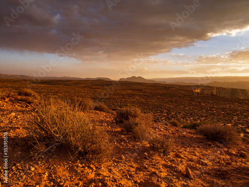 Desert landscape with dramatic clouds besides Horse Shoe Bend