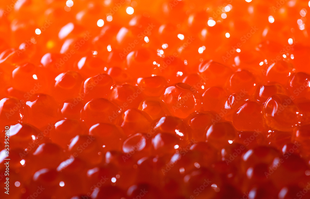 Red Caviar background. Close-up salmon caviar. Delicatessen. Texture of red caviar. Backdrop. Healthy Seafood. Red Caviar background. Close-up salmon caviar. Delicatessen. Texture of red caviar. Backdrop. Healthy Seafood.