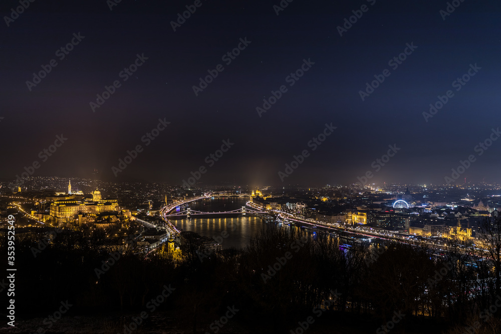 Beautiful and peaceful night view of the city lights over the Danube River in Budapest