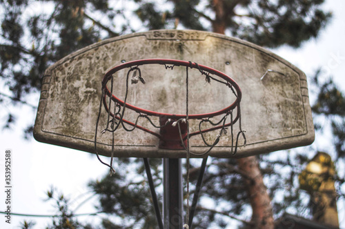 Abandoned basketball hoop in the park