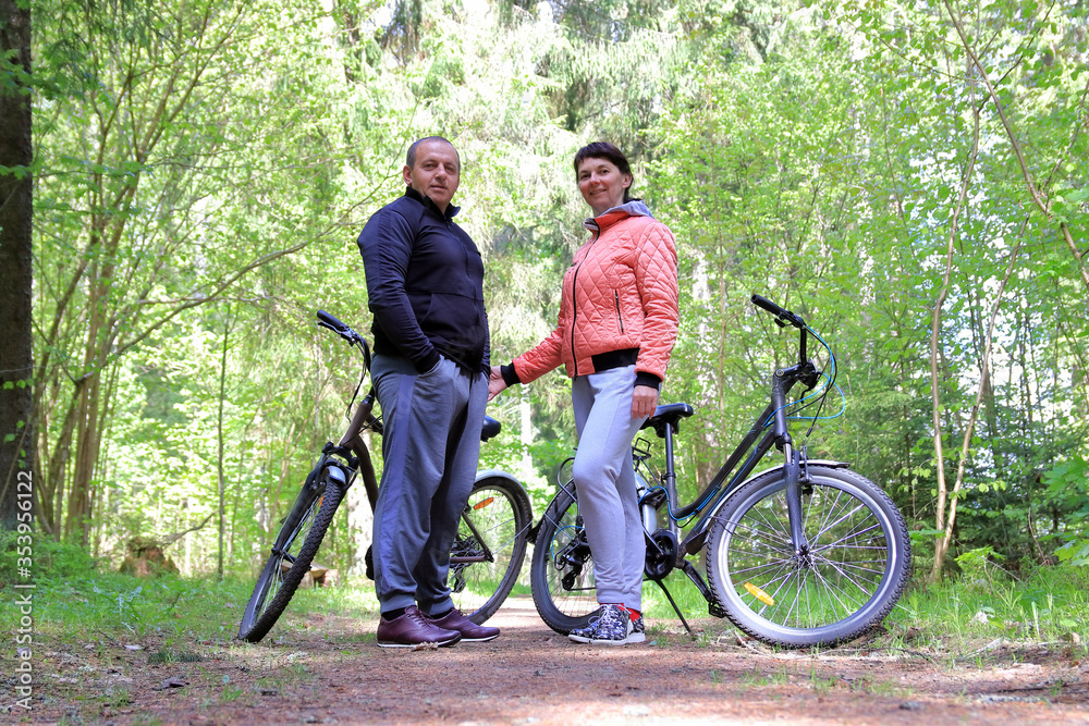 couple on bikes in the forest