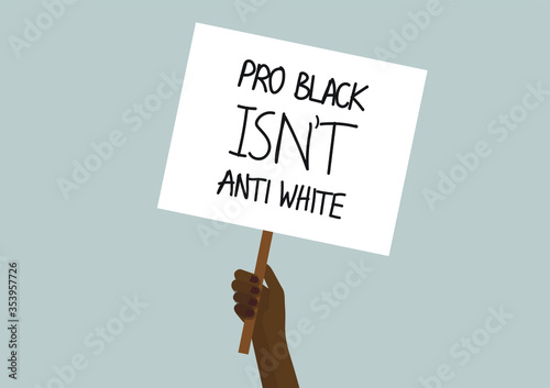 Hand holding a PRO BLACK ISN’T ANTI WHITE protest placard