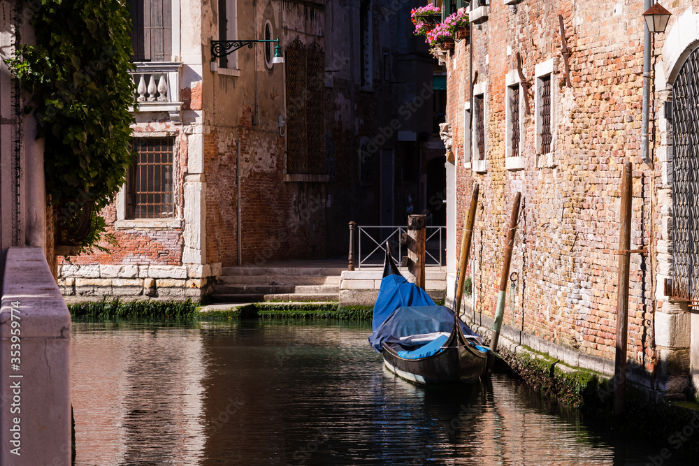 moored gondola on a water canal in Venice 