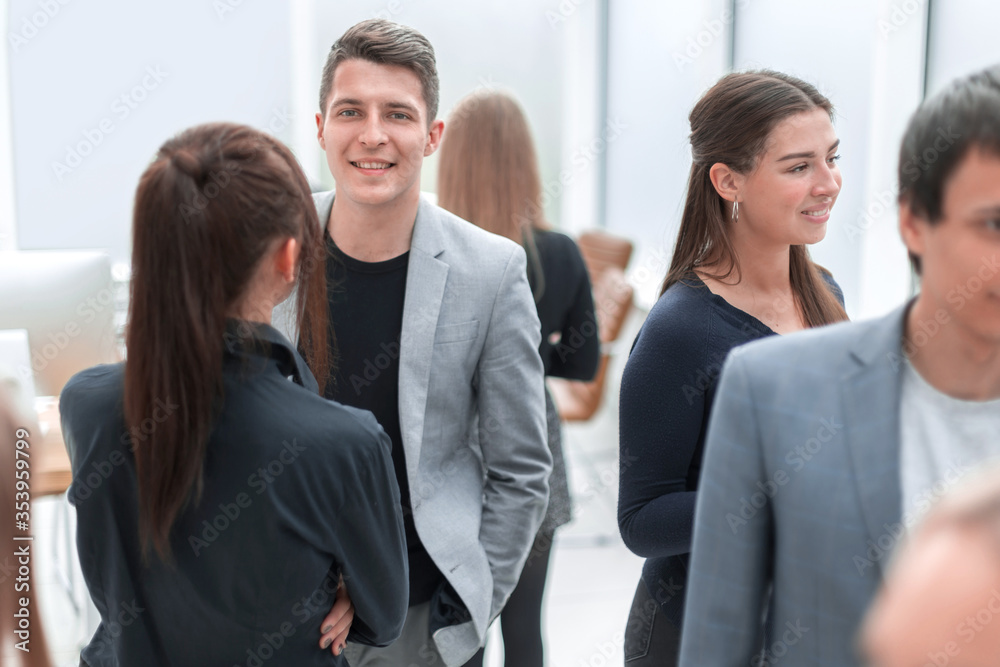 group of diverse employees standing in the office. group of diverse employees standing in the office.