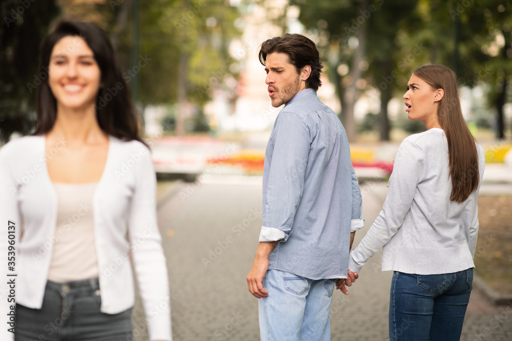 Boyfriend Looking At Other Girl Walking With Irritated Girlfriend Outdoor Boyfriend Looking At Other Girl Walking With Irritated Girlfriend Outdoor