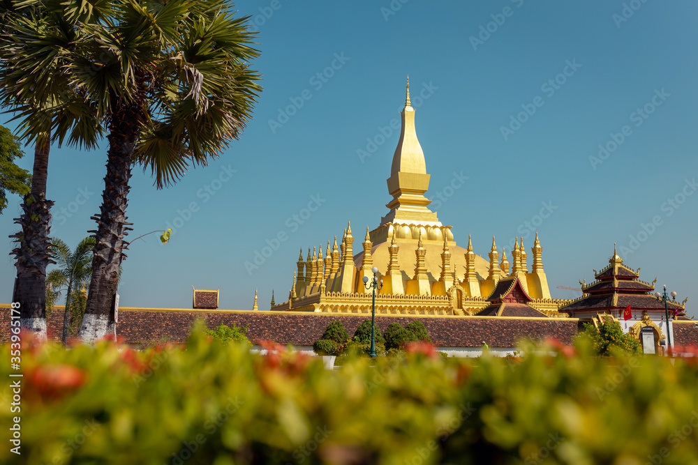 Golden Pagoda in Vientiane, Laos. Pha That Luang at Vientiane. Blue sky background beautiful.