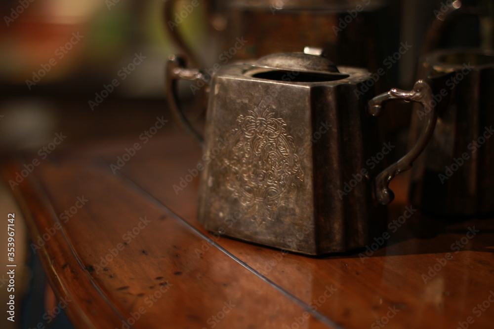 Vintage teapot close-up, beautiful metal antique utensils