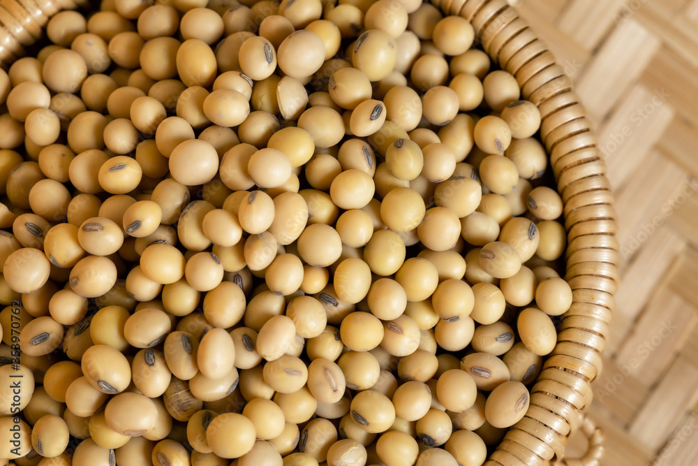 Soybeans in a wooden bowl on the table Soybeans in a wooden bowl on the table