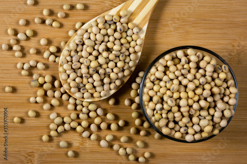 Soybeans in a wooden spoon on the table