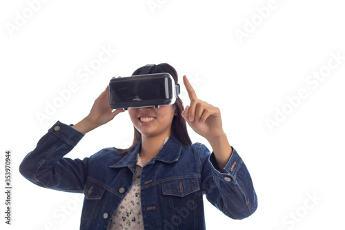 Portrait of a young beautiful woman with VR goggles in studio