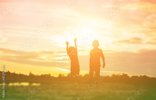 kid silhouette,Moments of the child's joy. On the Nature sunset