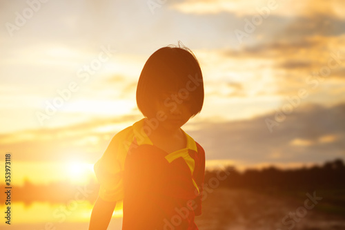 kid silhouette,Moments of the child's joy. On the Nature sunset © chaunpis