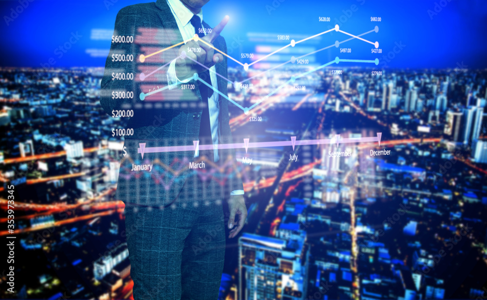 Businessman touch financial graph and city of business in trading business and technology background Businessman touch financial graph and city of business in trading business and technology background