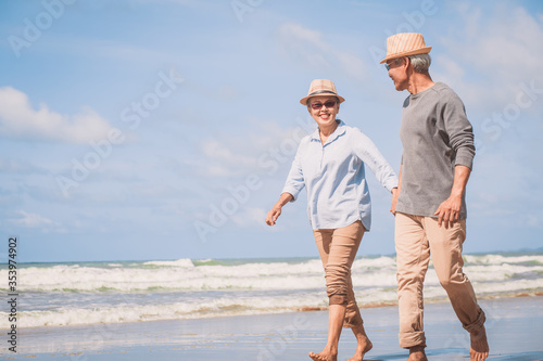 Retired couple enjoying walking together each other talking happily. Love is everything.. Retirement age concept and love, copy space for text
