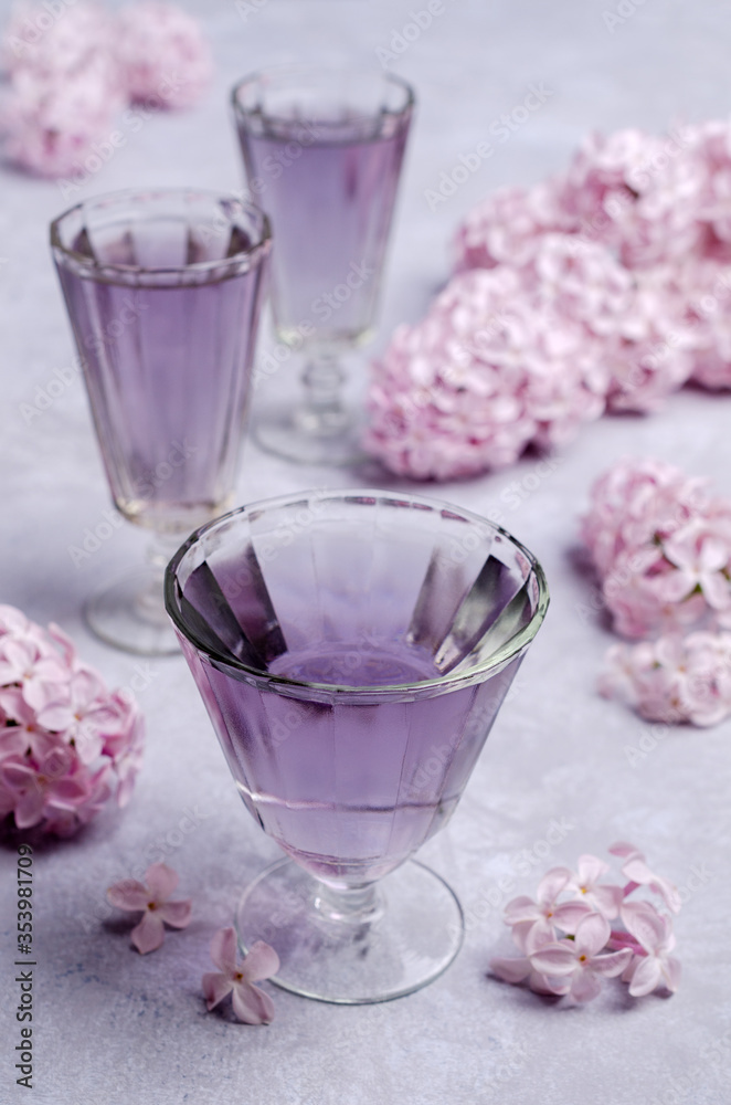 Transparent lilac drink in glass