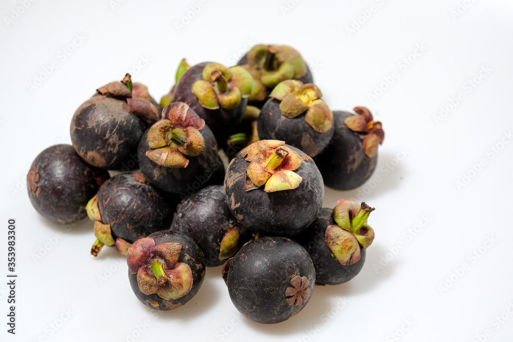 Close-Up Of Mangosteen Fruits On Table Close-Up Of Mangosteen Fruits On Table