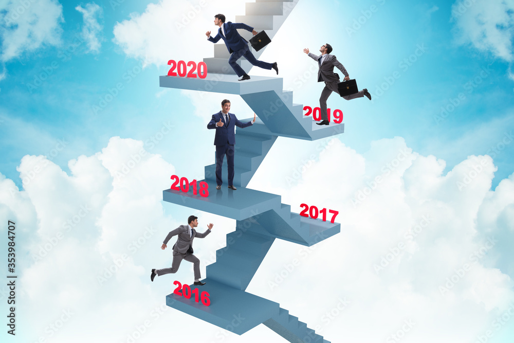 Businessman climbing stairs on yearly basis Businessman climbing stairs on yearly basis