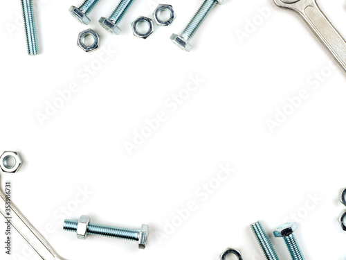 Text insertion frame lined with bolts, nuts and wrenches
