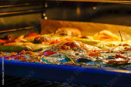 A home-made pizza baking in the oven