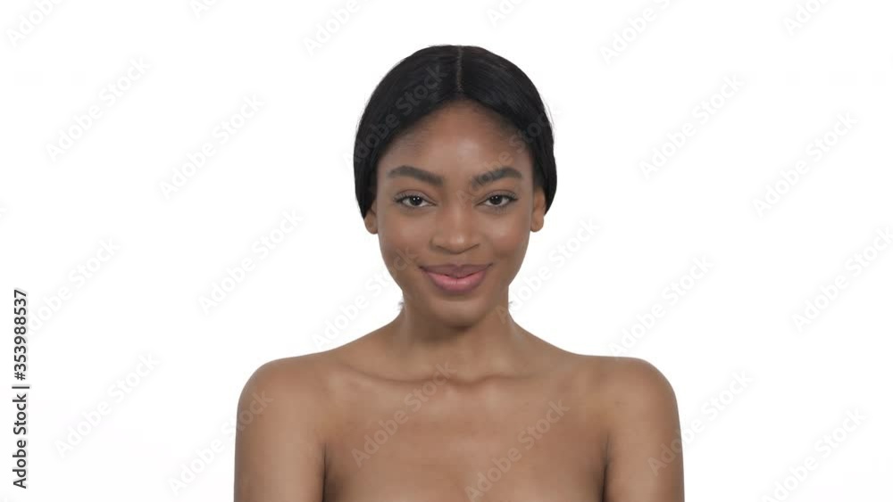 Cheerful attractive surprised young woman happily smiling to camera covering her mouth with hands. Camera glamorous presentation Cheerful attractive surprised young woman happily smiling to camera covering her mouth with hands. Camera glamorous presentation